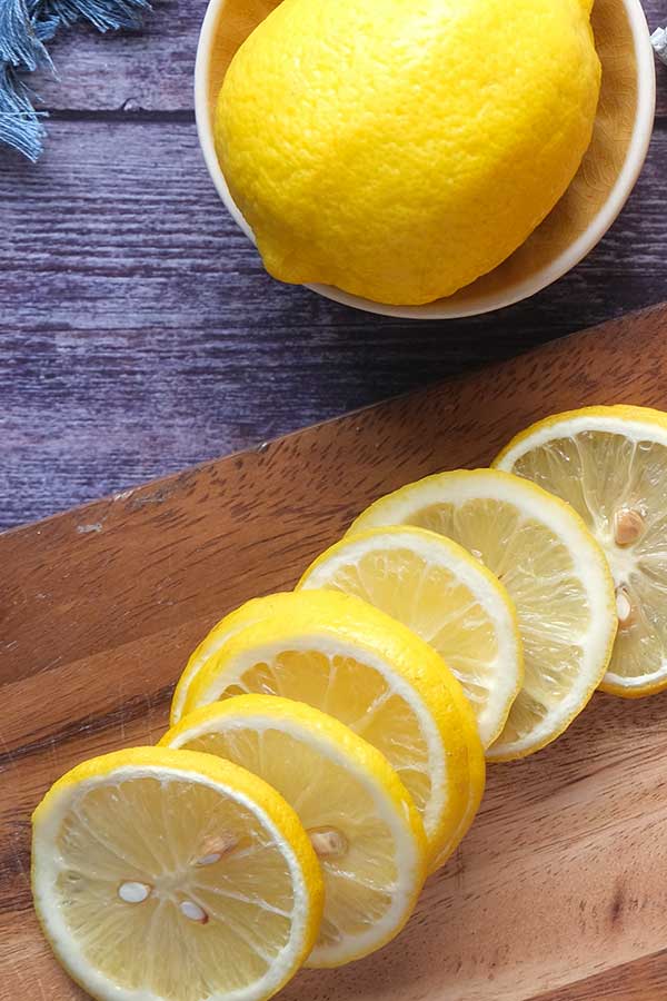sliced lemon on a cutting board