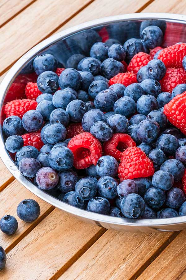 blueberries and raspberries in a bowl