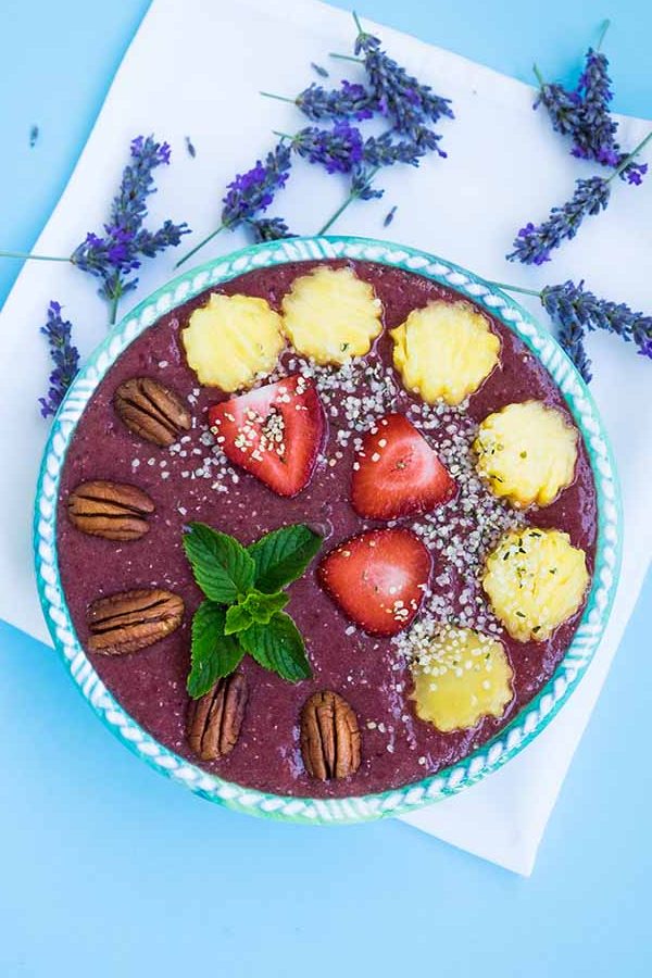 healthy blackberry smoothie bowl with pineapples