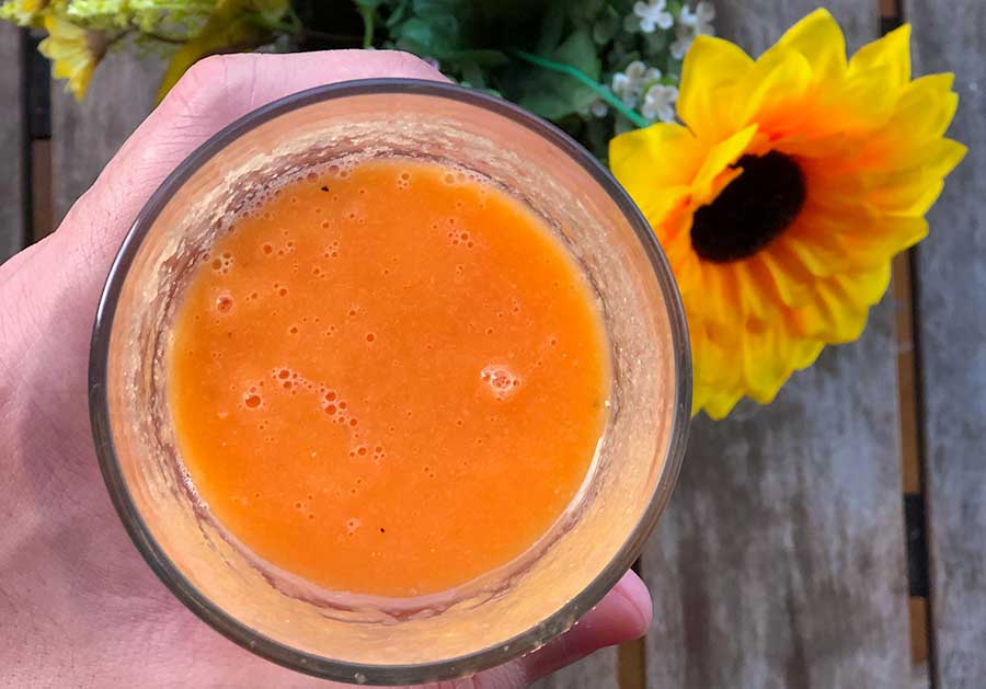 carrot juice for acne in a glass