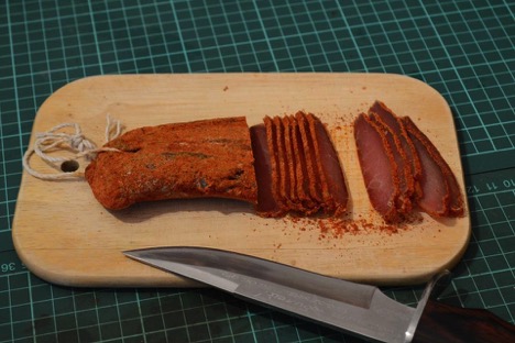 sliced smoked beef on a cutting board