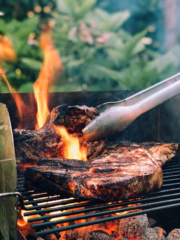 barbecuing steaks