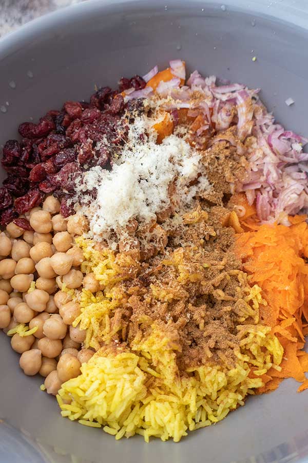 ingredients for moroccan rice salad, chickpeas, rice, onions, raisins, spices