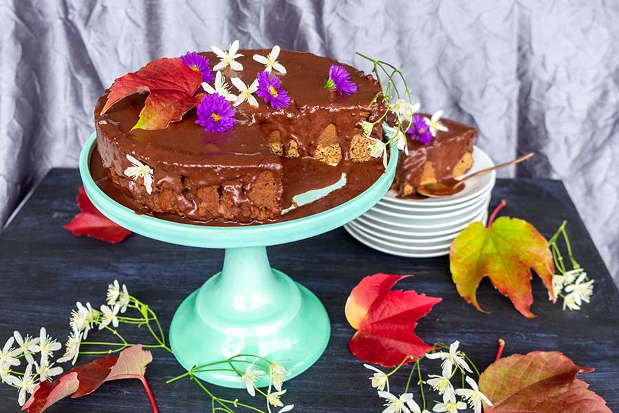 chocolate pumpkin cake on a cake platter, gluten free