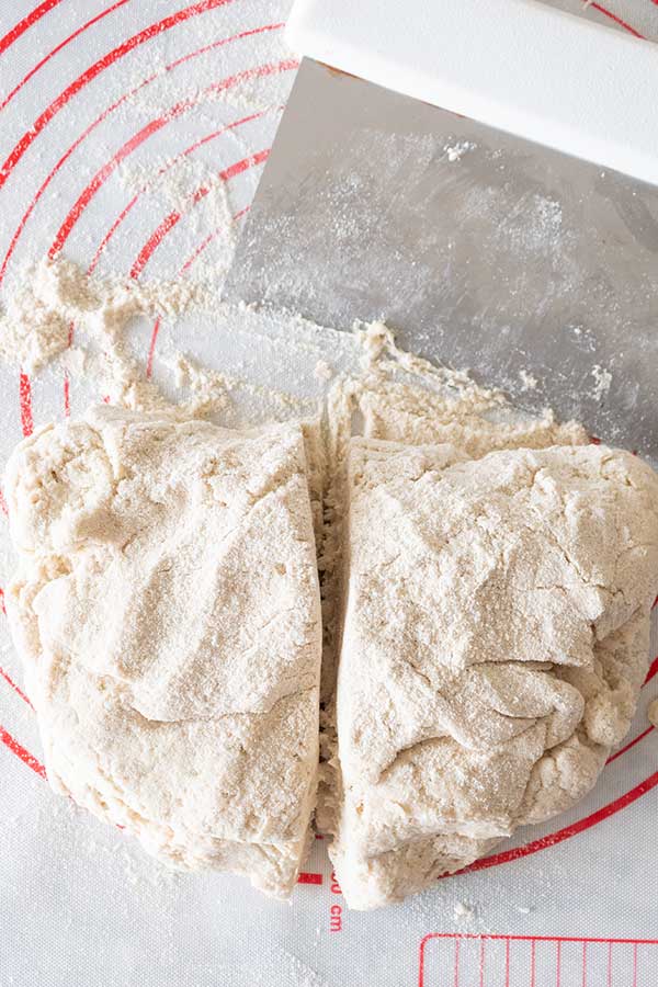 ciabatta dough on pastry mat cut in half