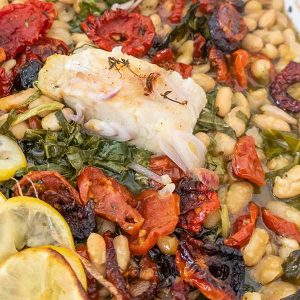 Roast Fish with Cannellini Beans Sundried Tomatoes and Greens
