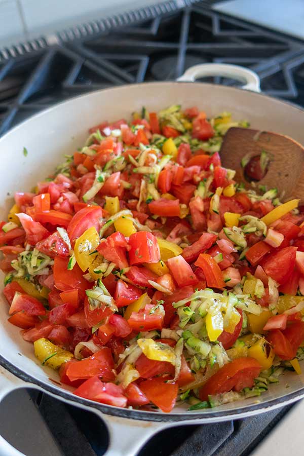 tomatoes zucchini bell peppers in a skillet